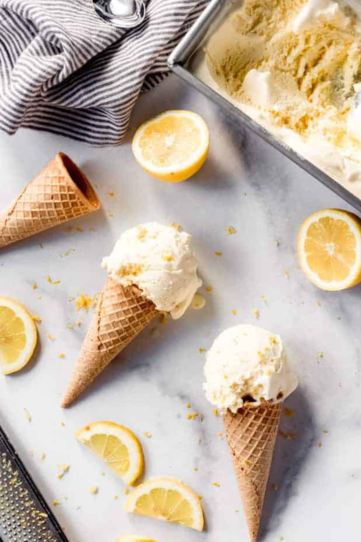 three ice cream cones with lemon ice cream.