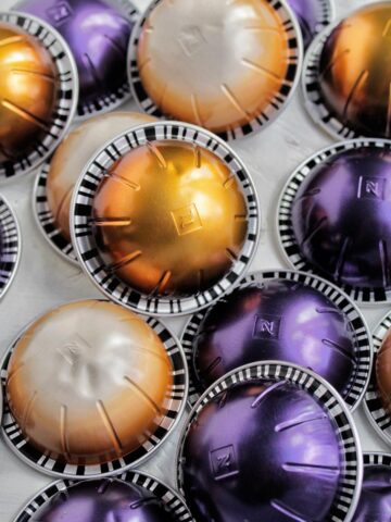 various colored Nespresso vertuo pods laying next to each other.