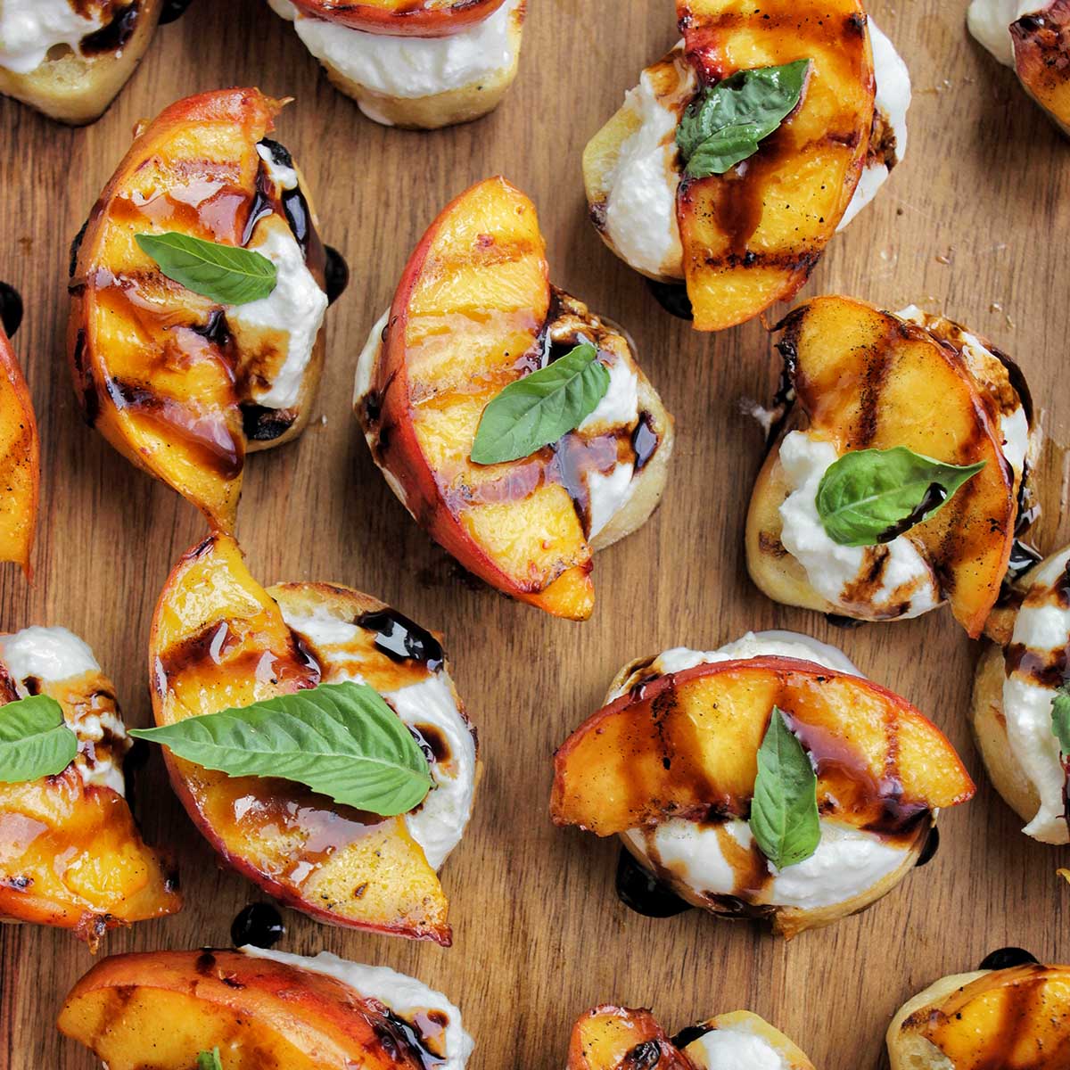 tray full of grilled peach crostini.