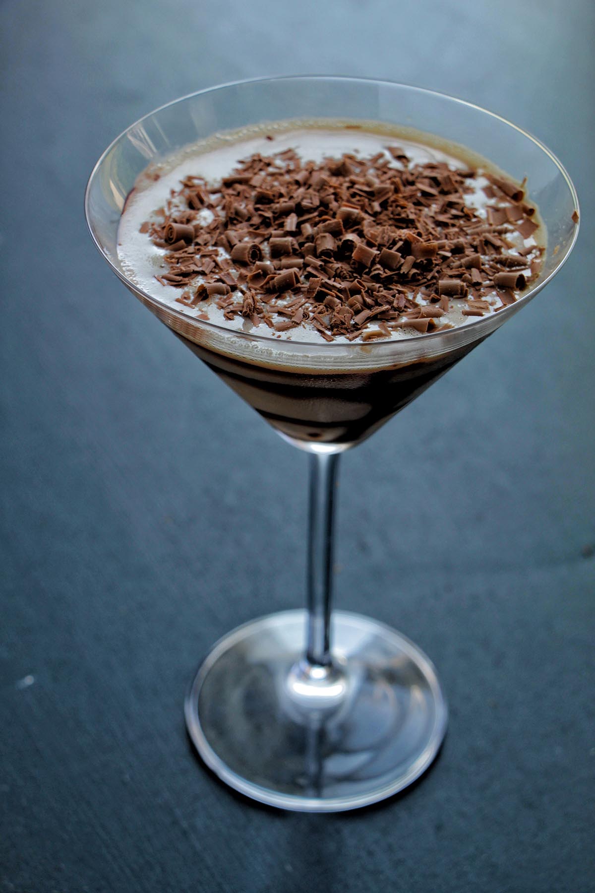 chocolate martini topped with chocolate shavings.