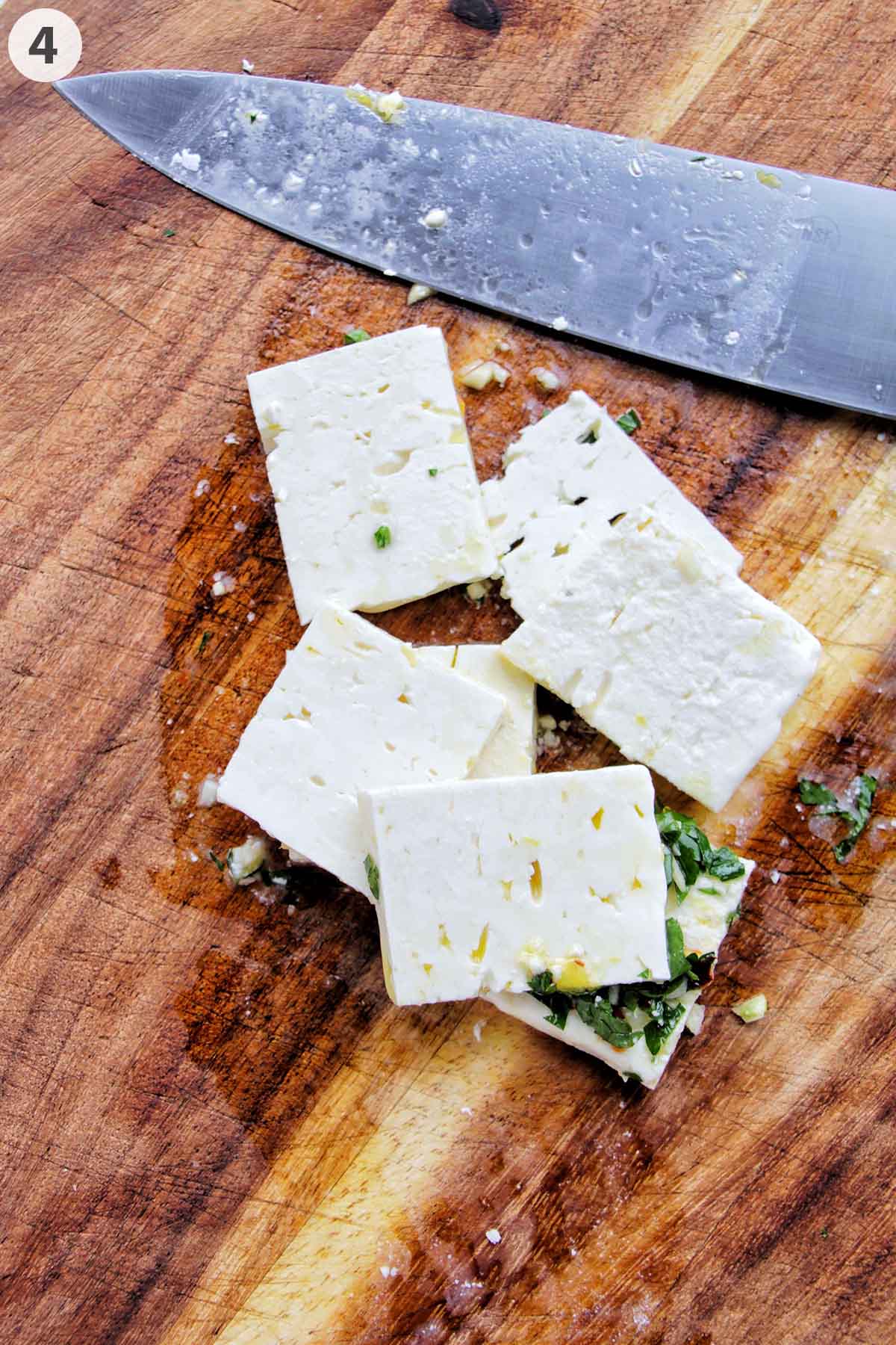numbered photo showing sliced feta cheese squares on a cutting board.