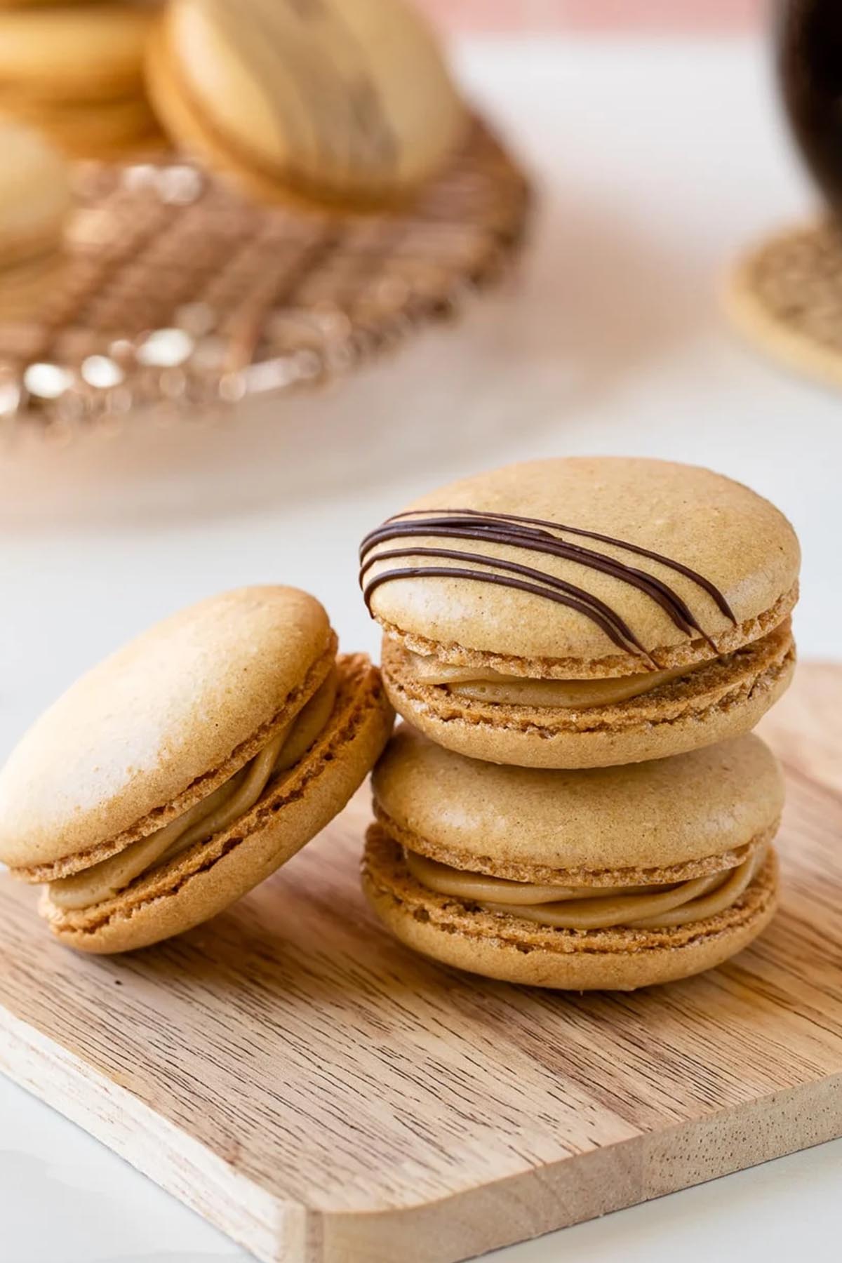 coffee macarons drizzled with chocolate.