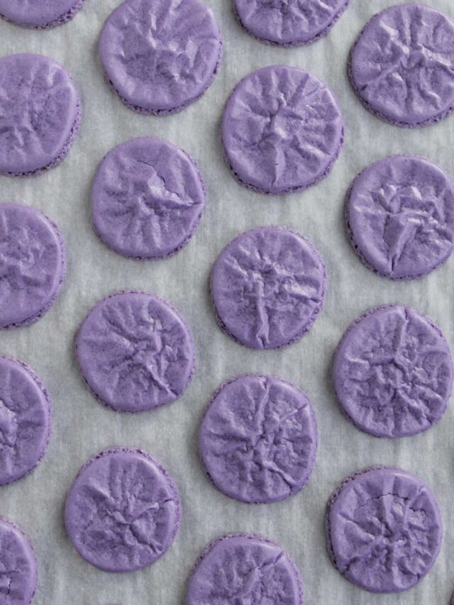 purple colored wrinkled macaron shells.