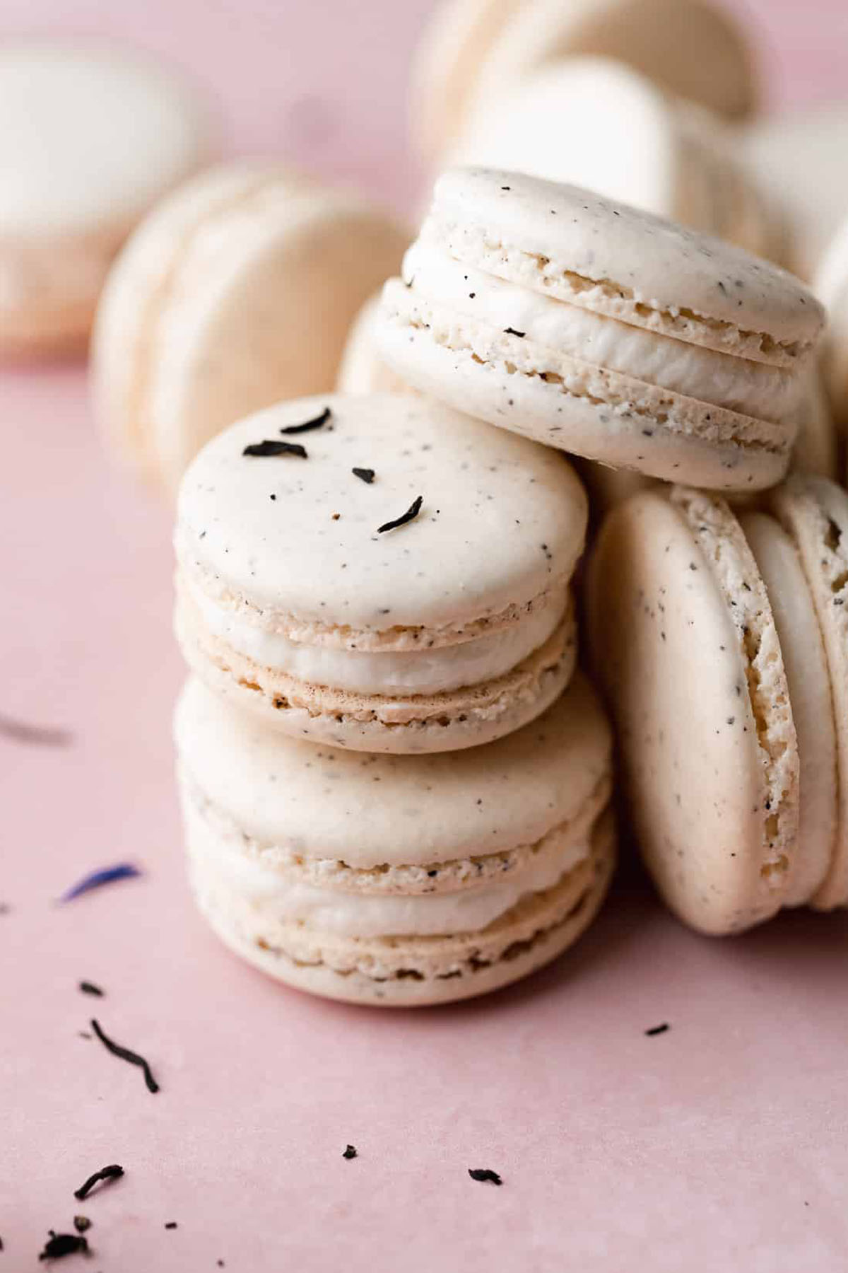 earl grey flavored macarons stacked on top of each other.