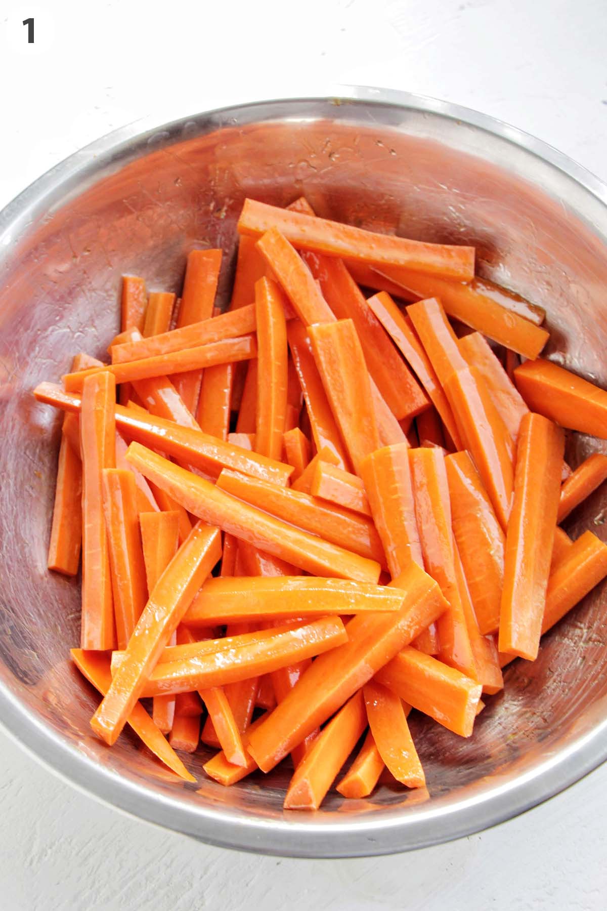 numbered photo showing carrot sticks in a mixing bowl.