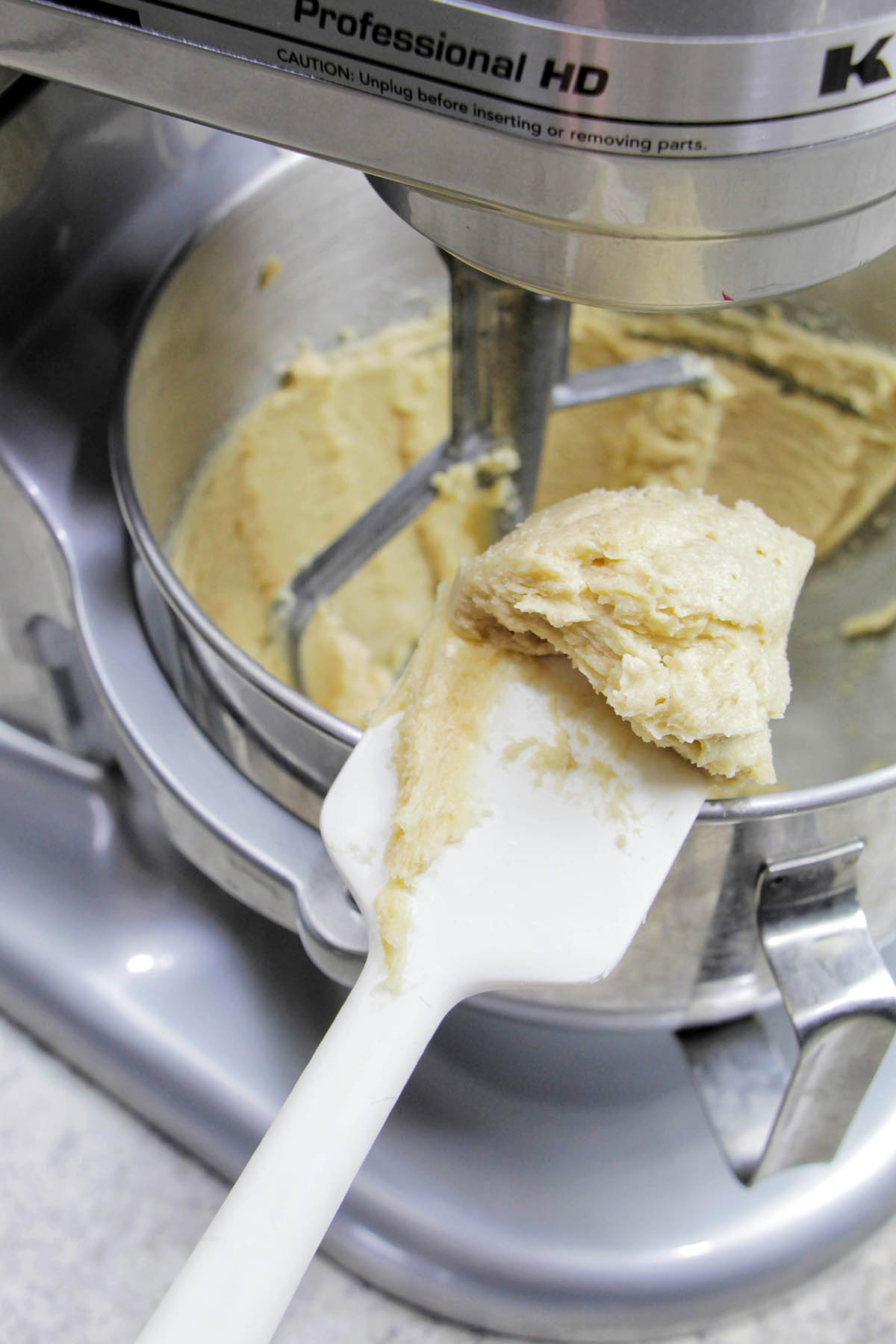 silicone spatula holding creamed butter.