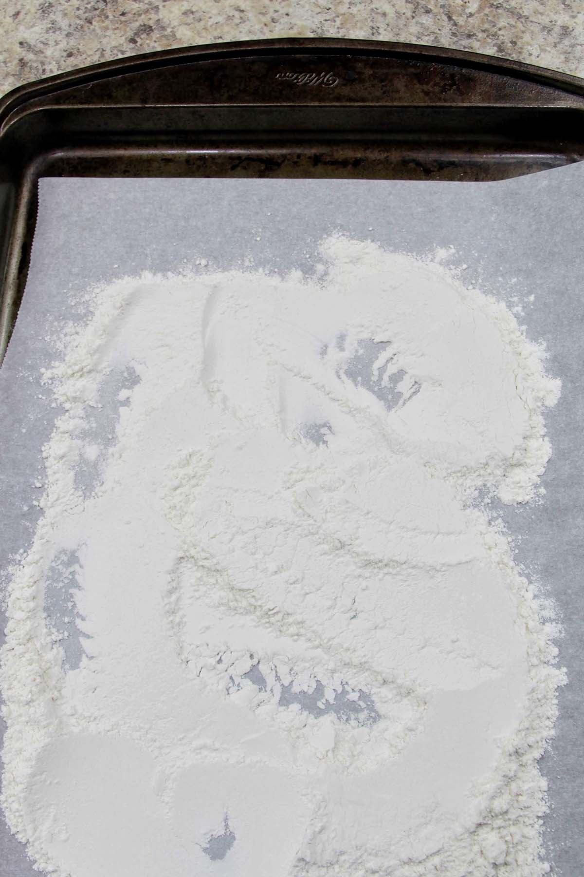 flour on a parchment lined baking sheet.