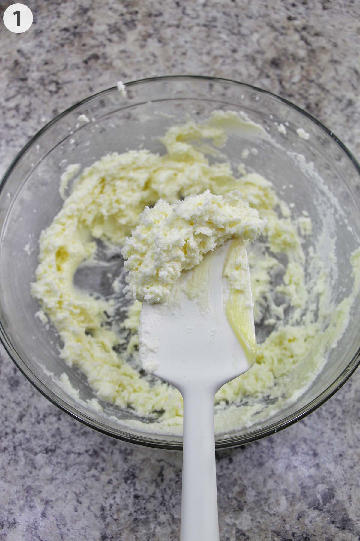 numbered photo showing creamed butter on a silicone spatula.