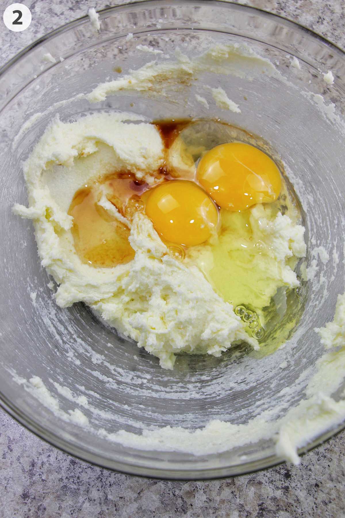 numbered photo showing eggs and vanilla with creamed butter.