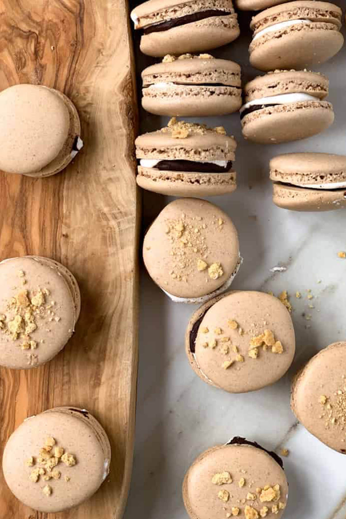 smores flavored macarons topped with graham crackers.