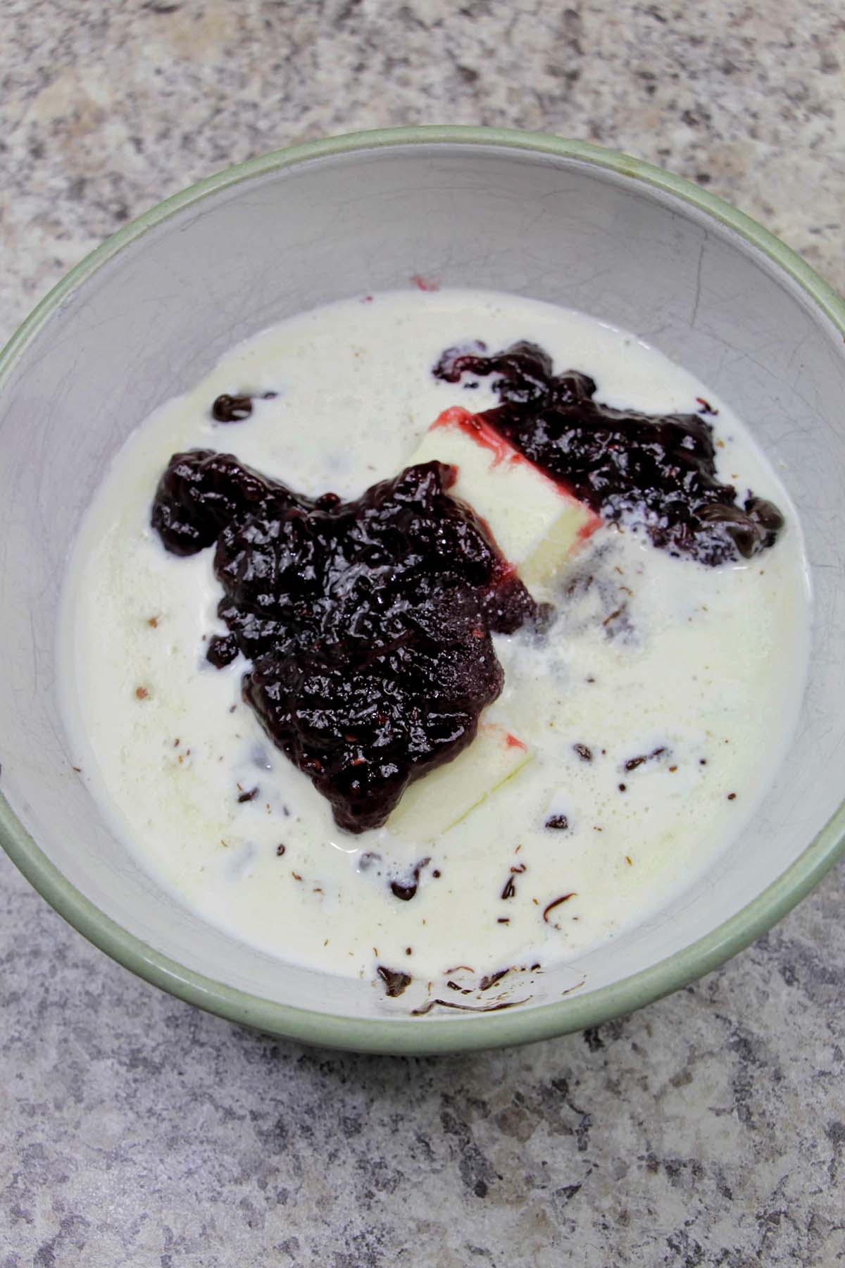 bowl with heavy cream, butter, and raspberry jam.
