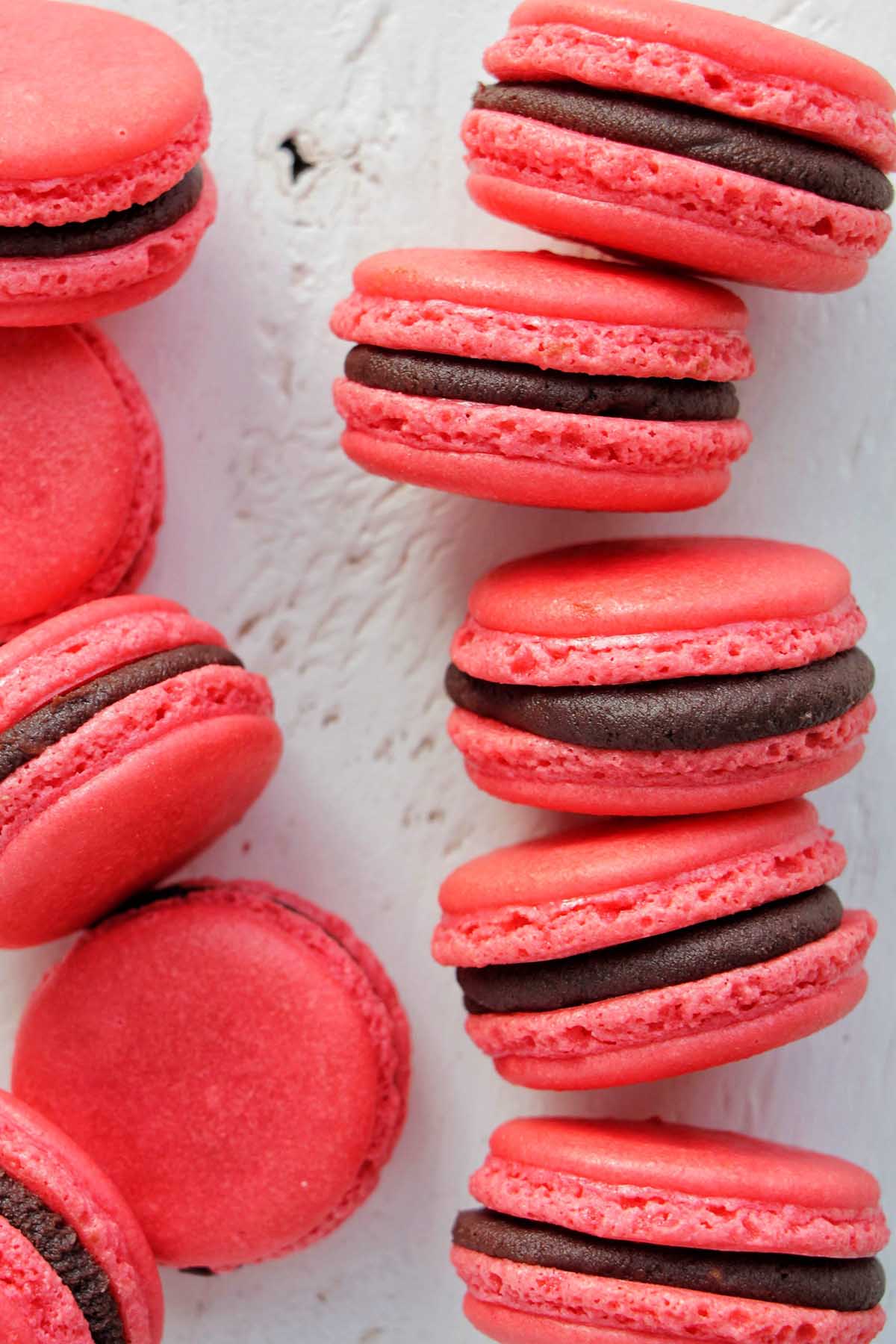 red macarons filled with raspberry chocolate ganache.