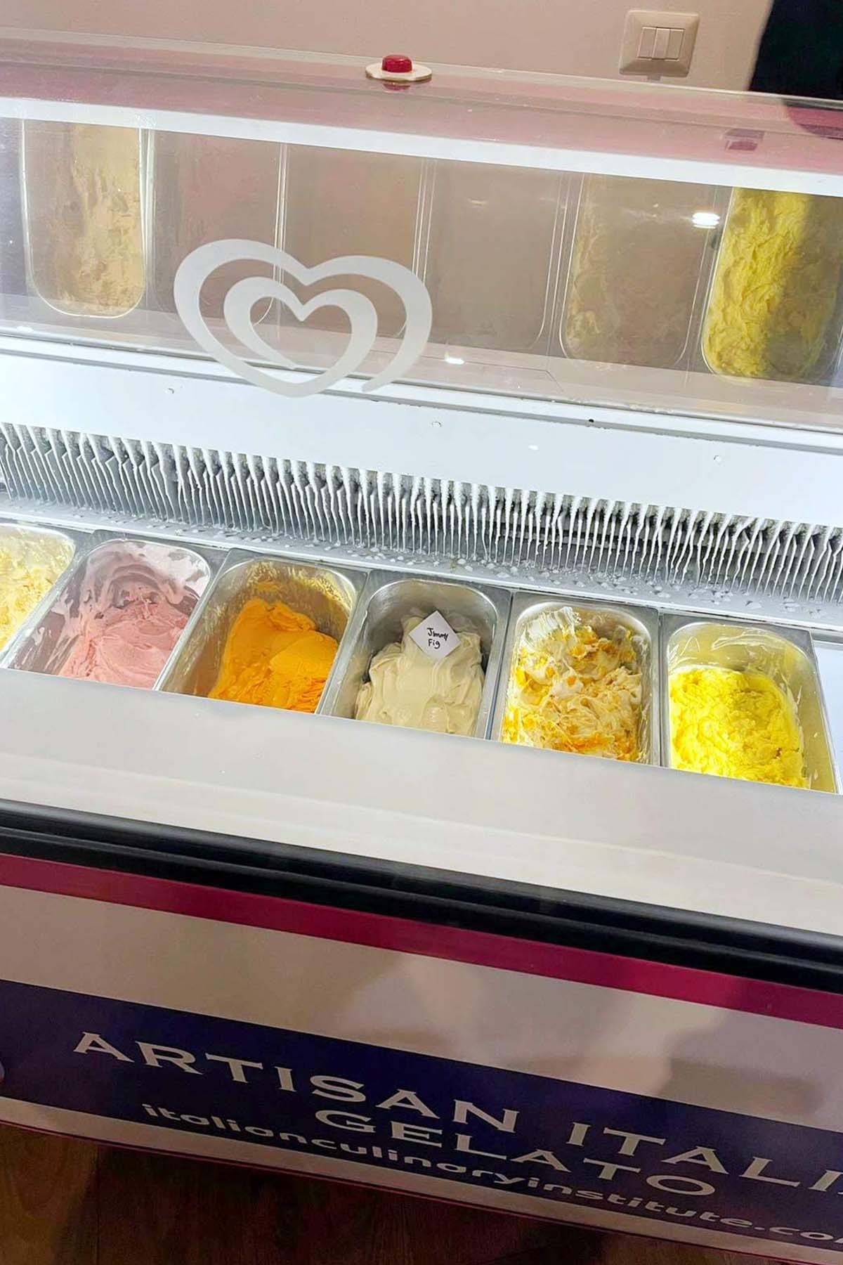 various gelato flavors stored in a display case.