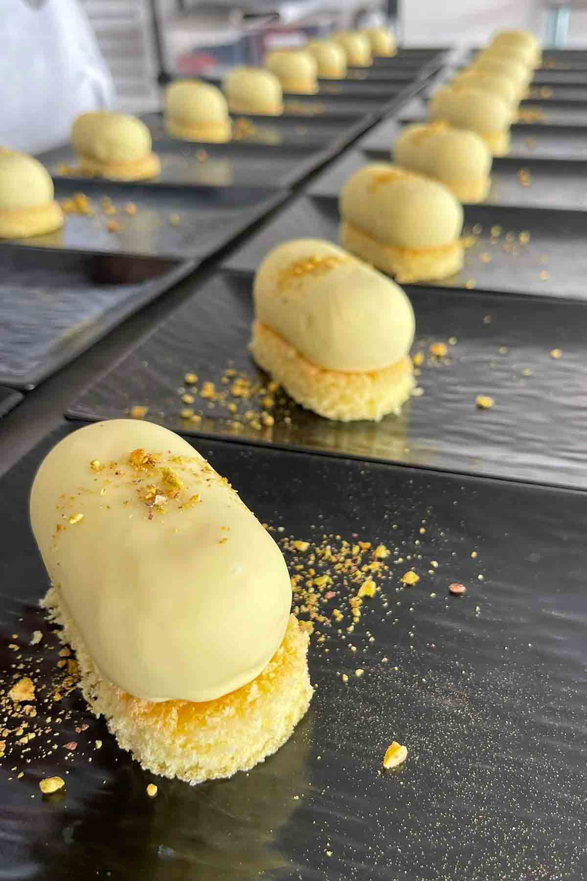 pistachio semifreddo dessert on white sponge cake.