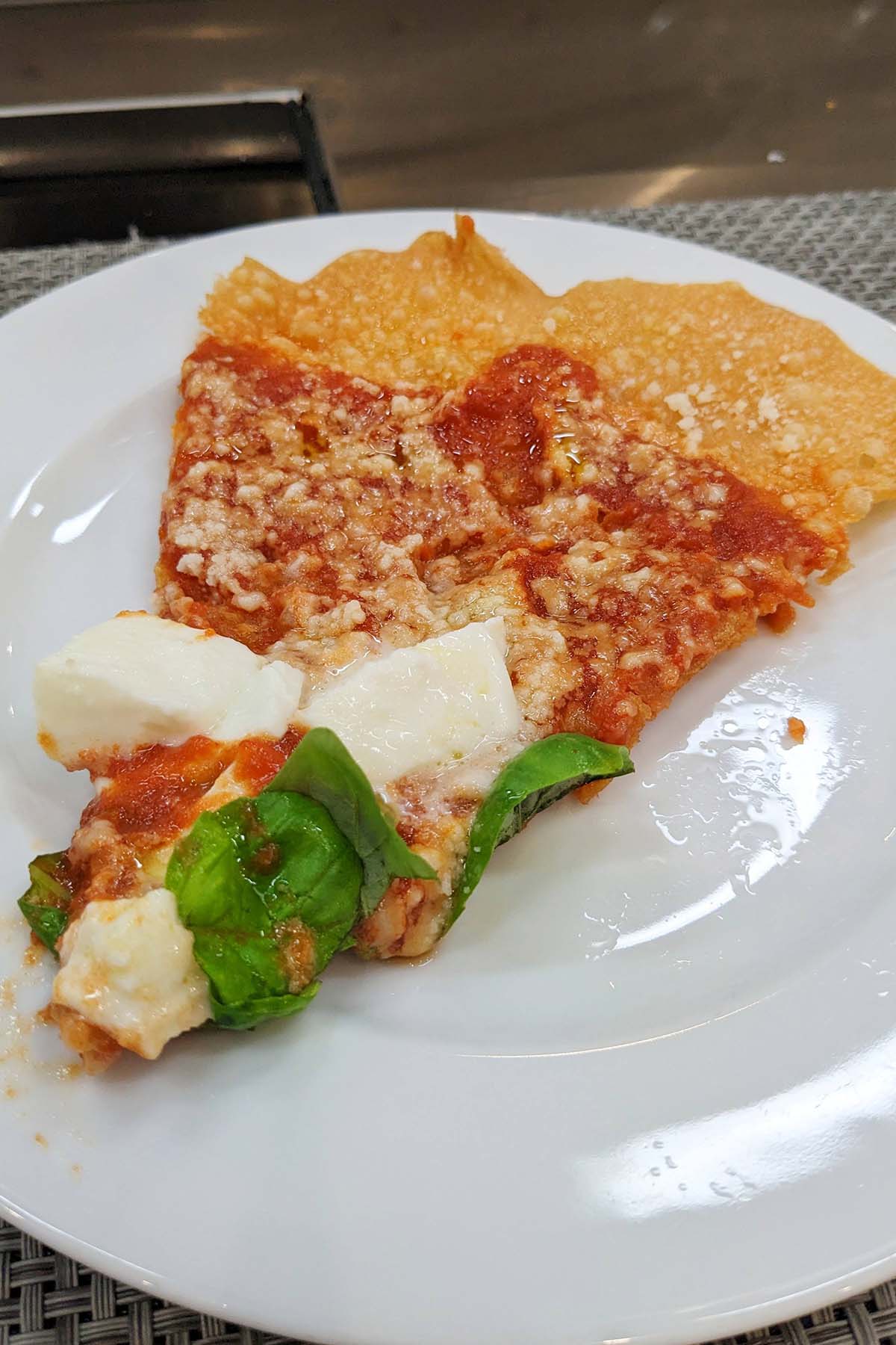 slice of pizza fritta on a white plate.