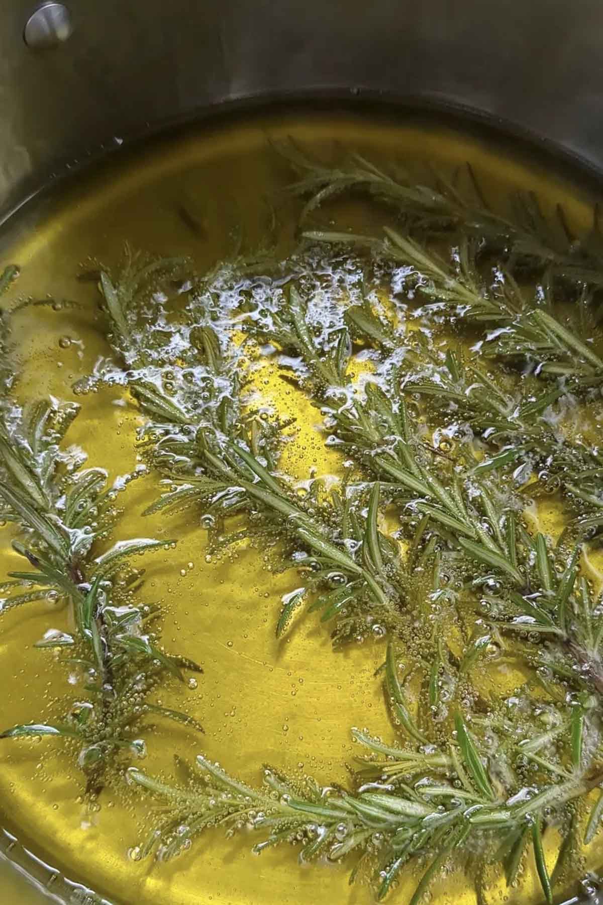 rosemary cooking in olive oil.