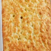 pan of baked focaccia bread with text overlay.