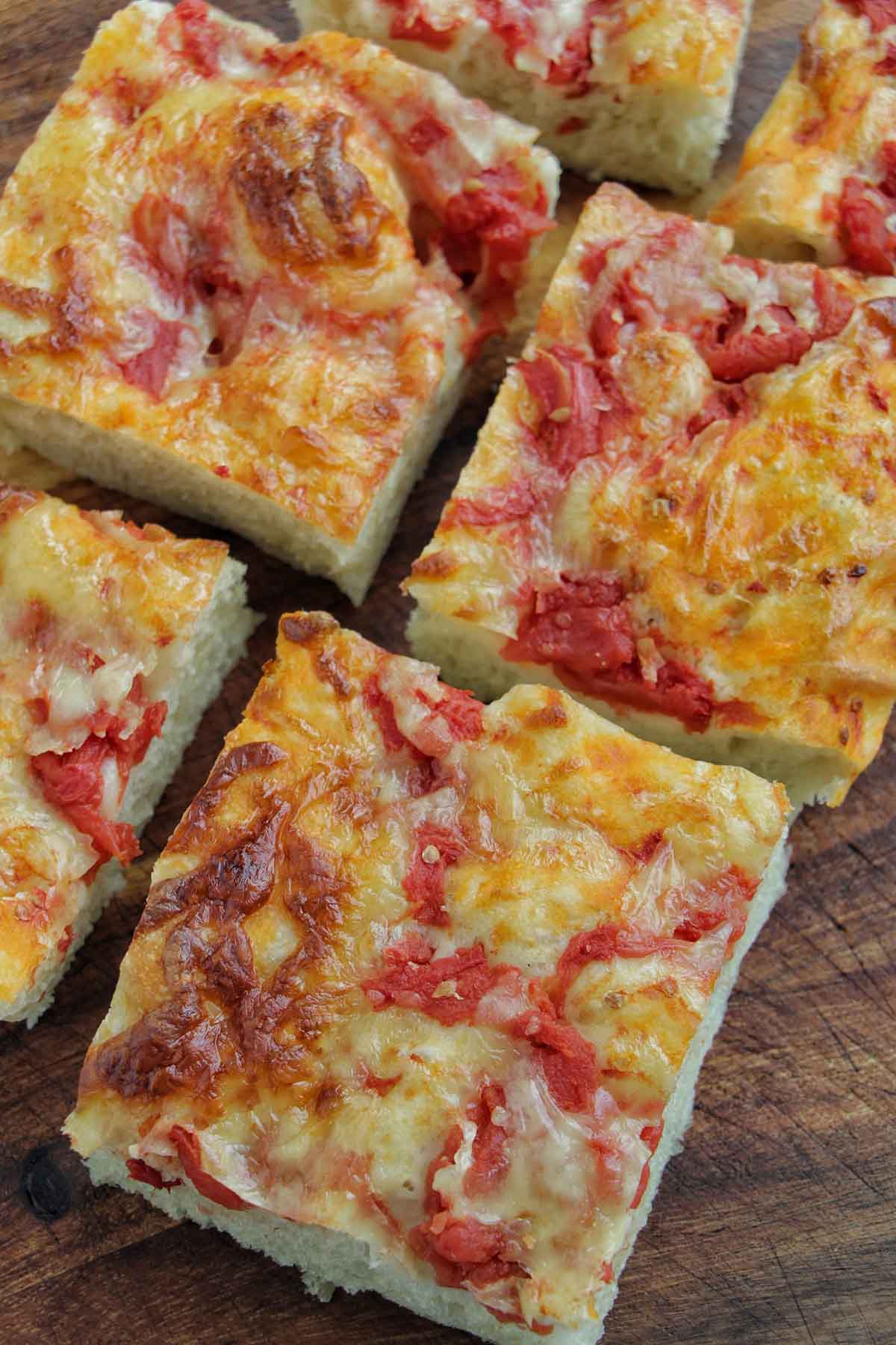 slices of cheese and tomato focaccia bread.
