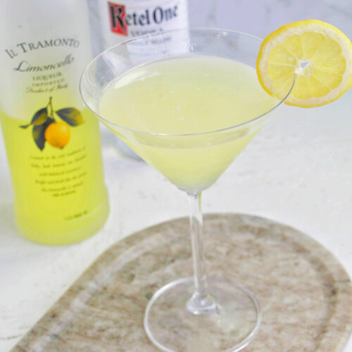 lemon drop martini garnished with a lemon wheel.