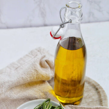 rosemary olive oil in a glass jar.