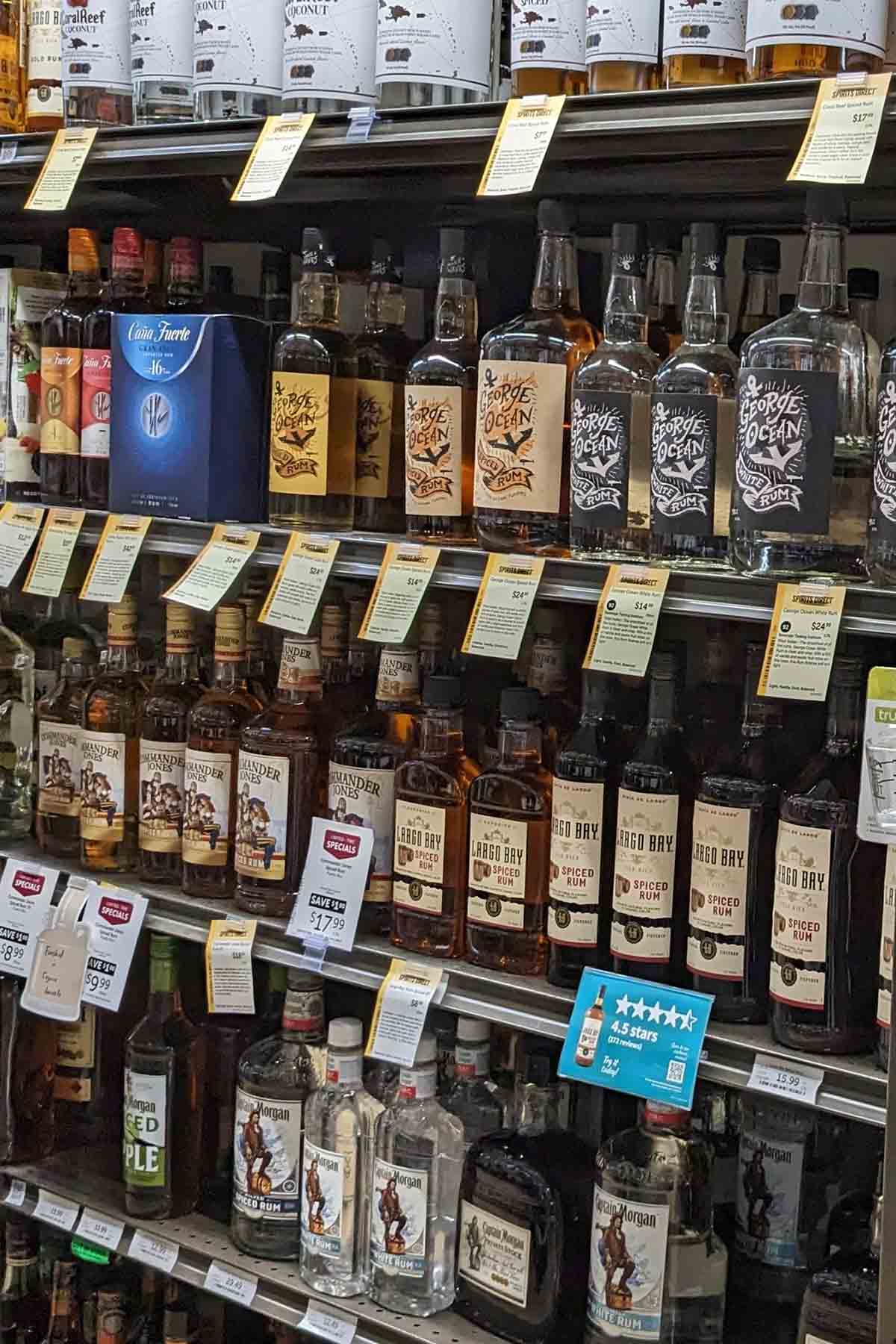 liquor store shelf with bottles of rum.