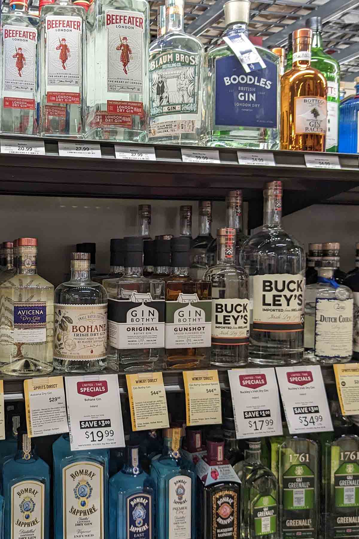 liquor store shelf with bottles of gin.