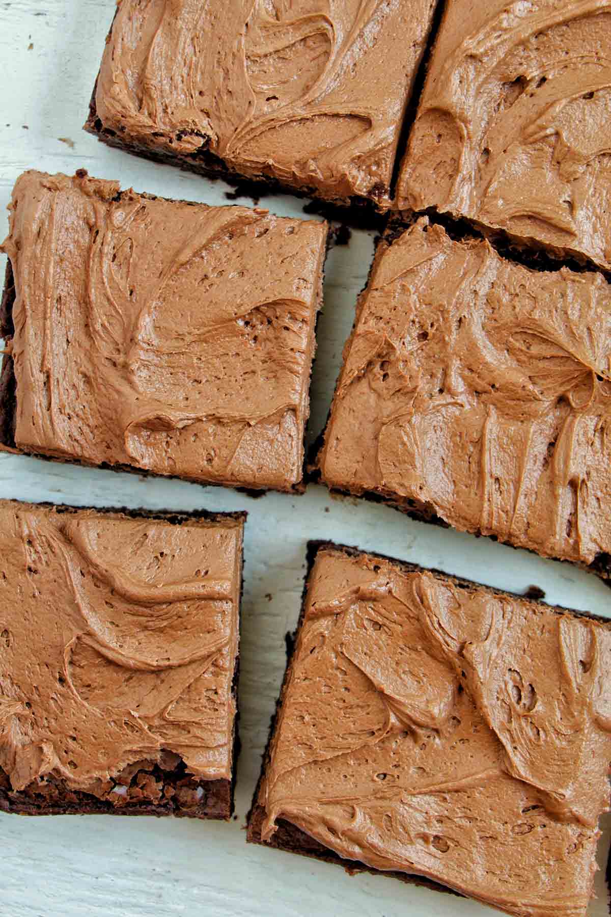 sliced brownies with chocolate frosting.