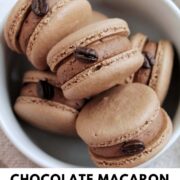 chocolate macarons in a bowl with text overlay.