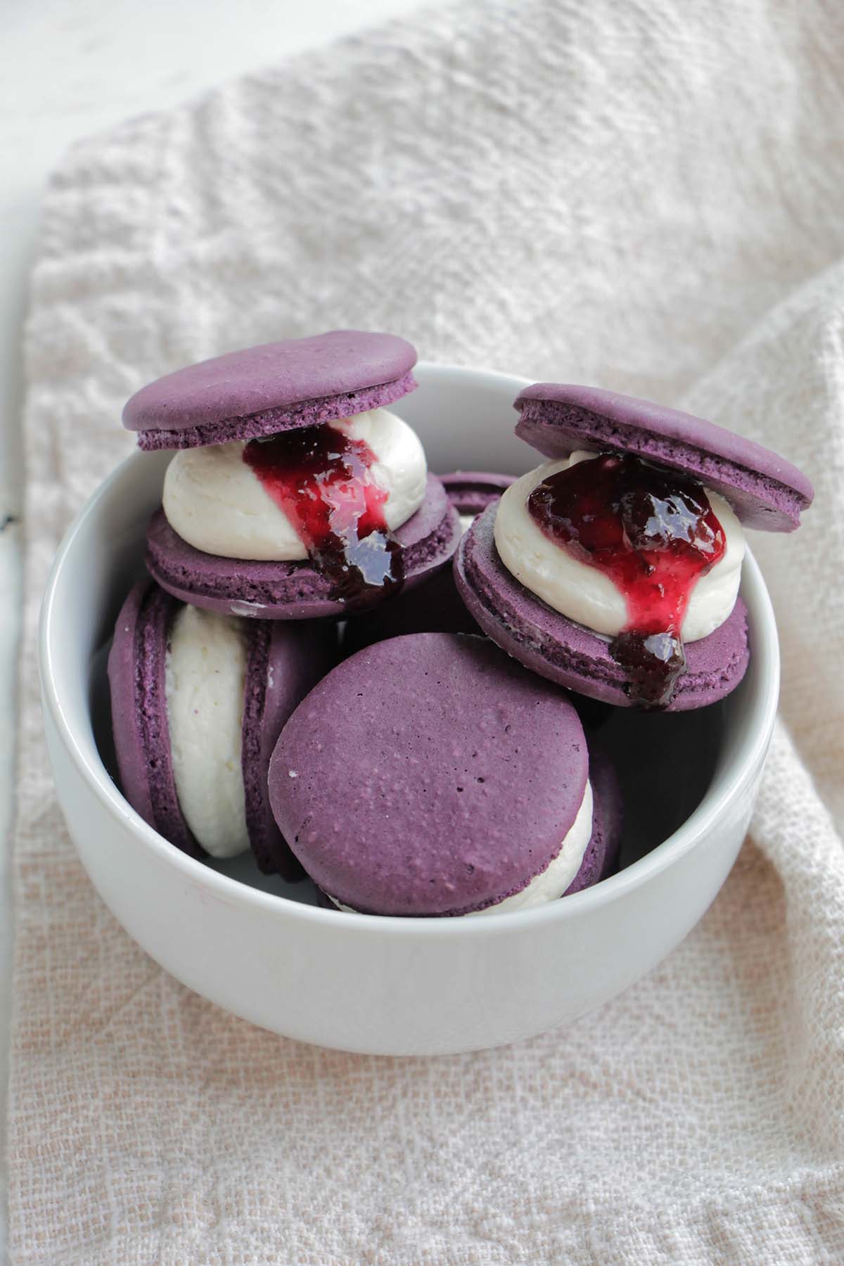 purple macarons filled with cherry compote.