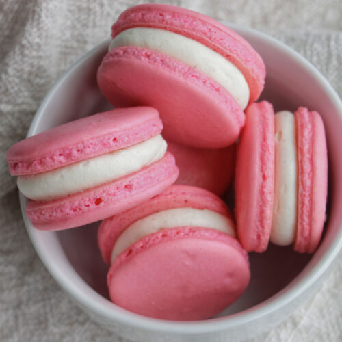 pink macarons filled with cream cheese.