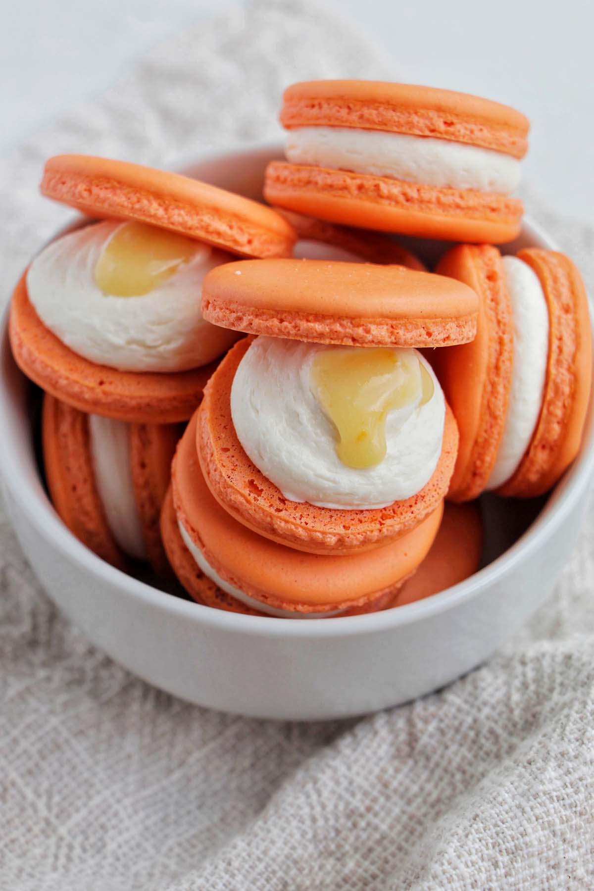 orange macarons filled with grapefruit curd.