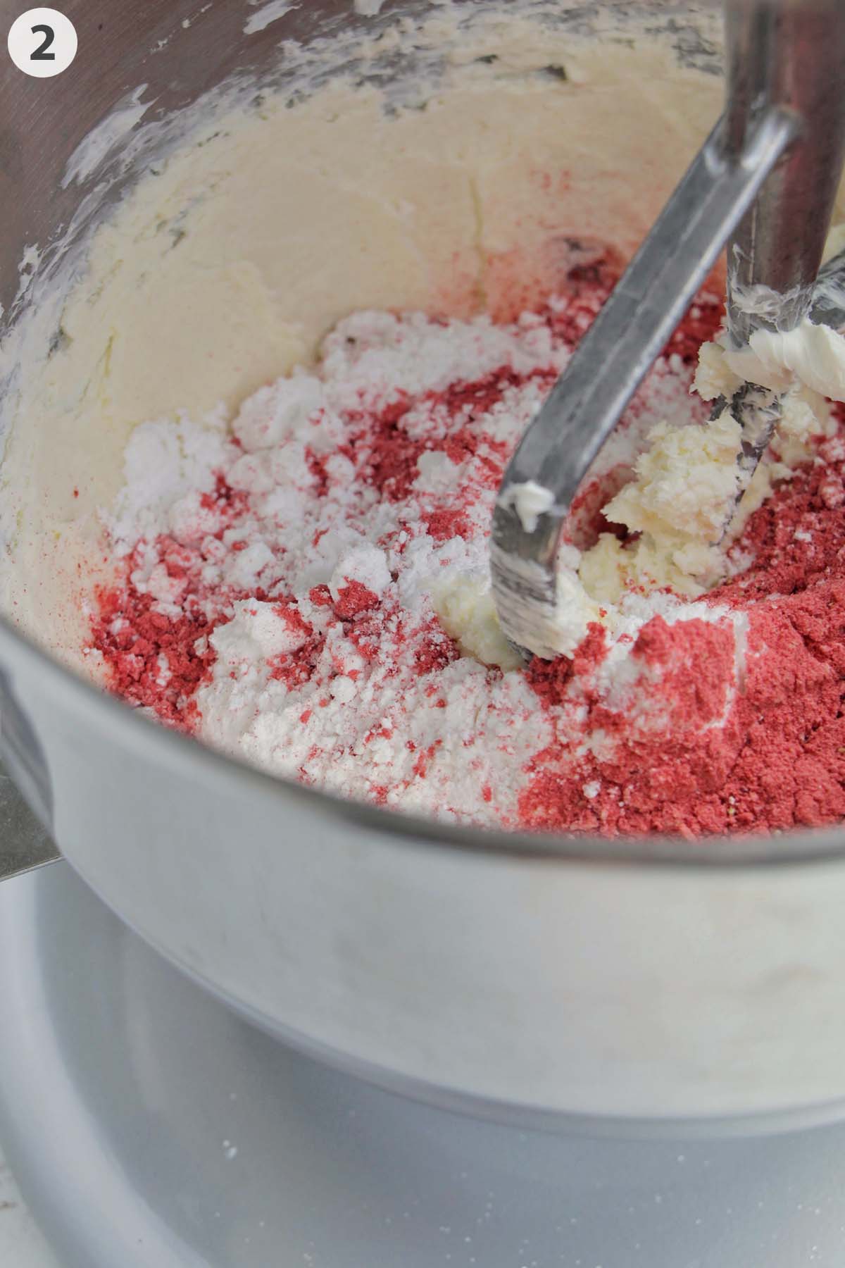 numbered photo showing confectioners' sugar and freeze dried strawberries mixing with butter.