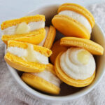 yellow macarons filled with buttercream and lemon curd filling.
