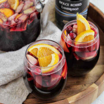 two wine glasses filled with Lambrusco sangria.