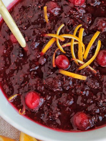 cranberry sauce in a white serving bowl.