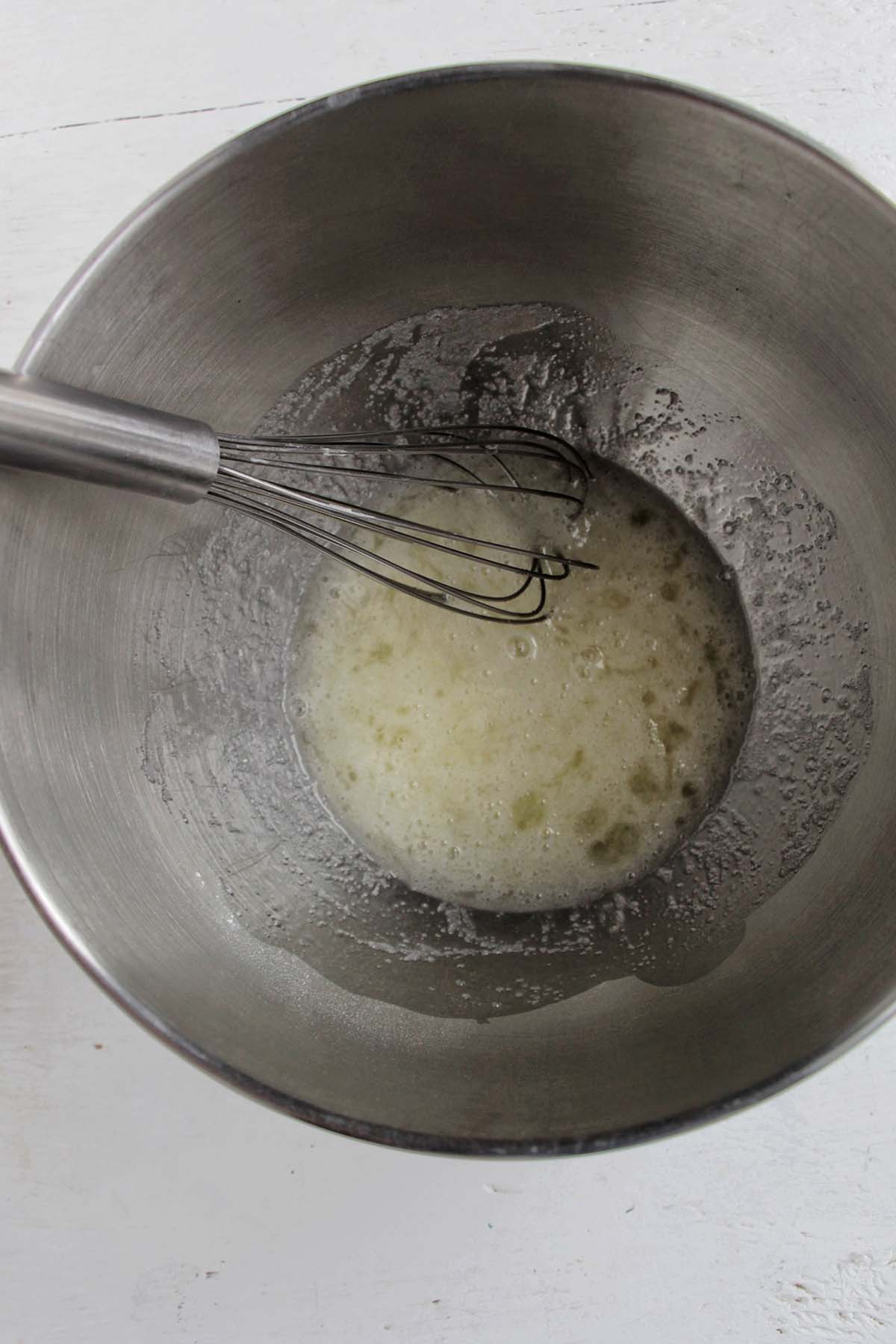 egg white and granulated sugar mixture in a bowl.