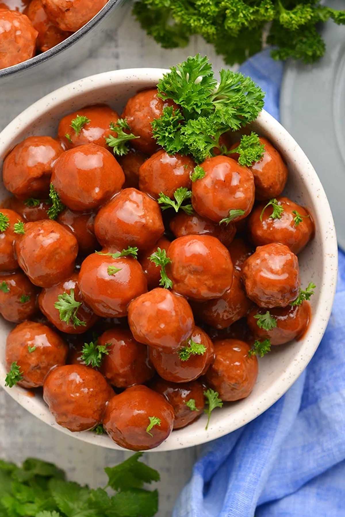 grape jelly meatballs in a serving bowl.