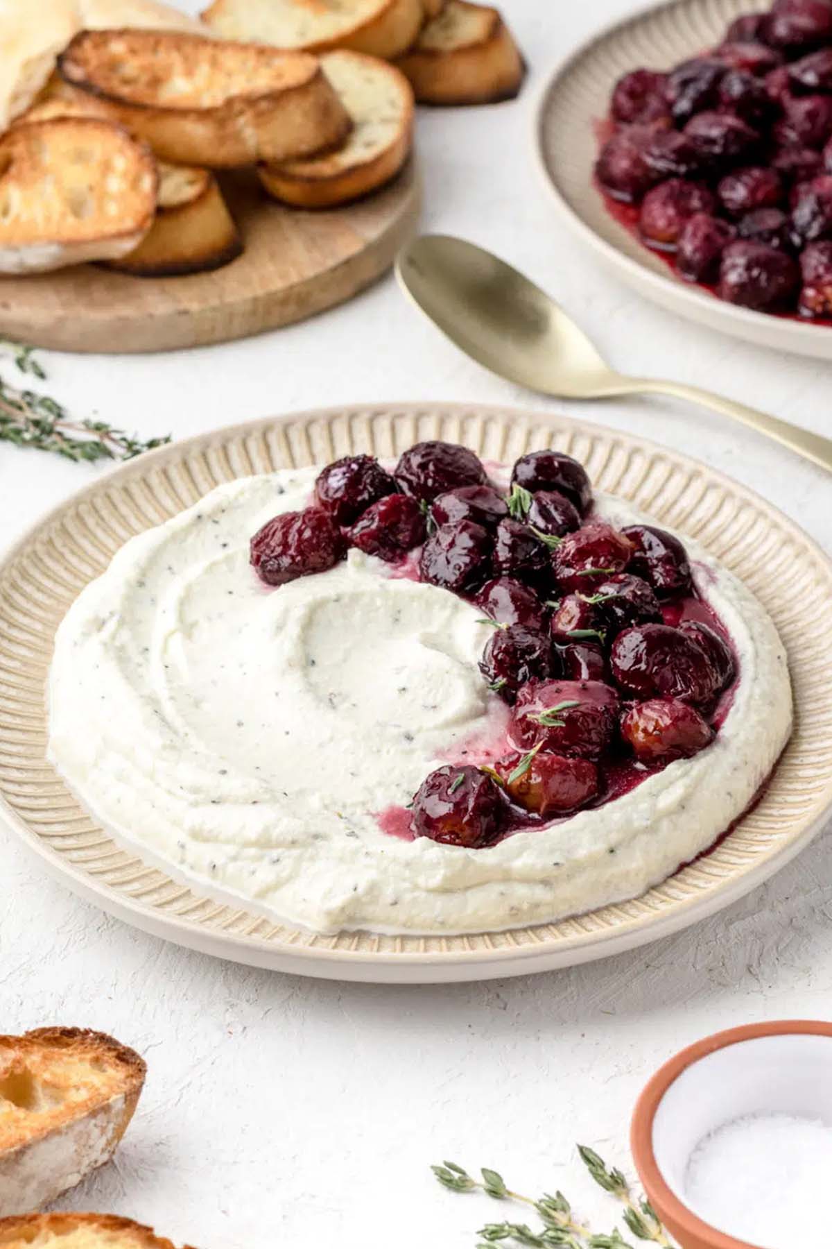 ricotta dip topped with roasted grapes.