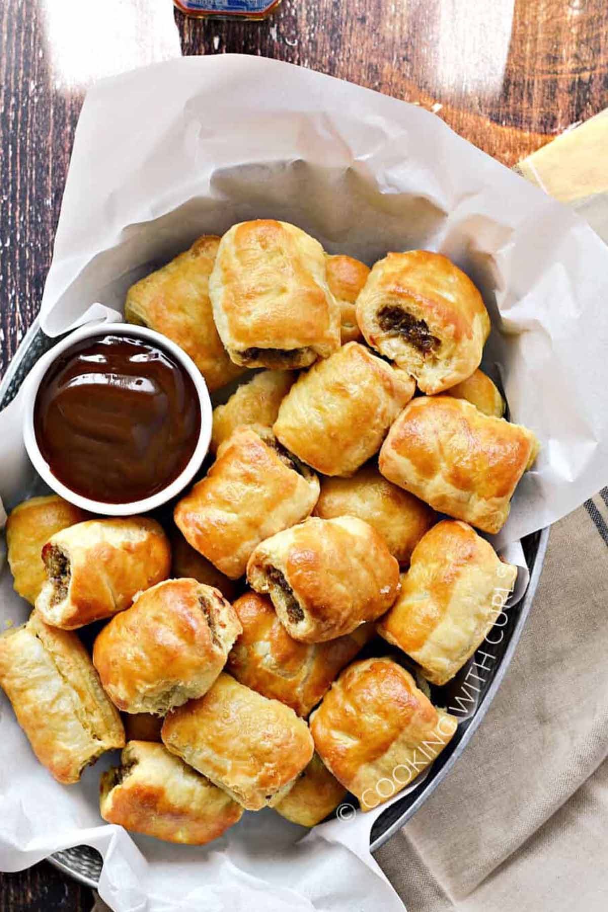 sausage puff pastry bites with dipping sauce.