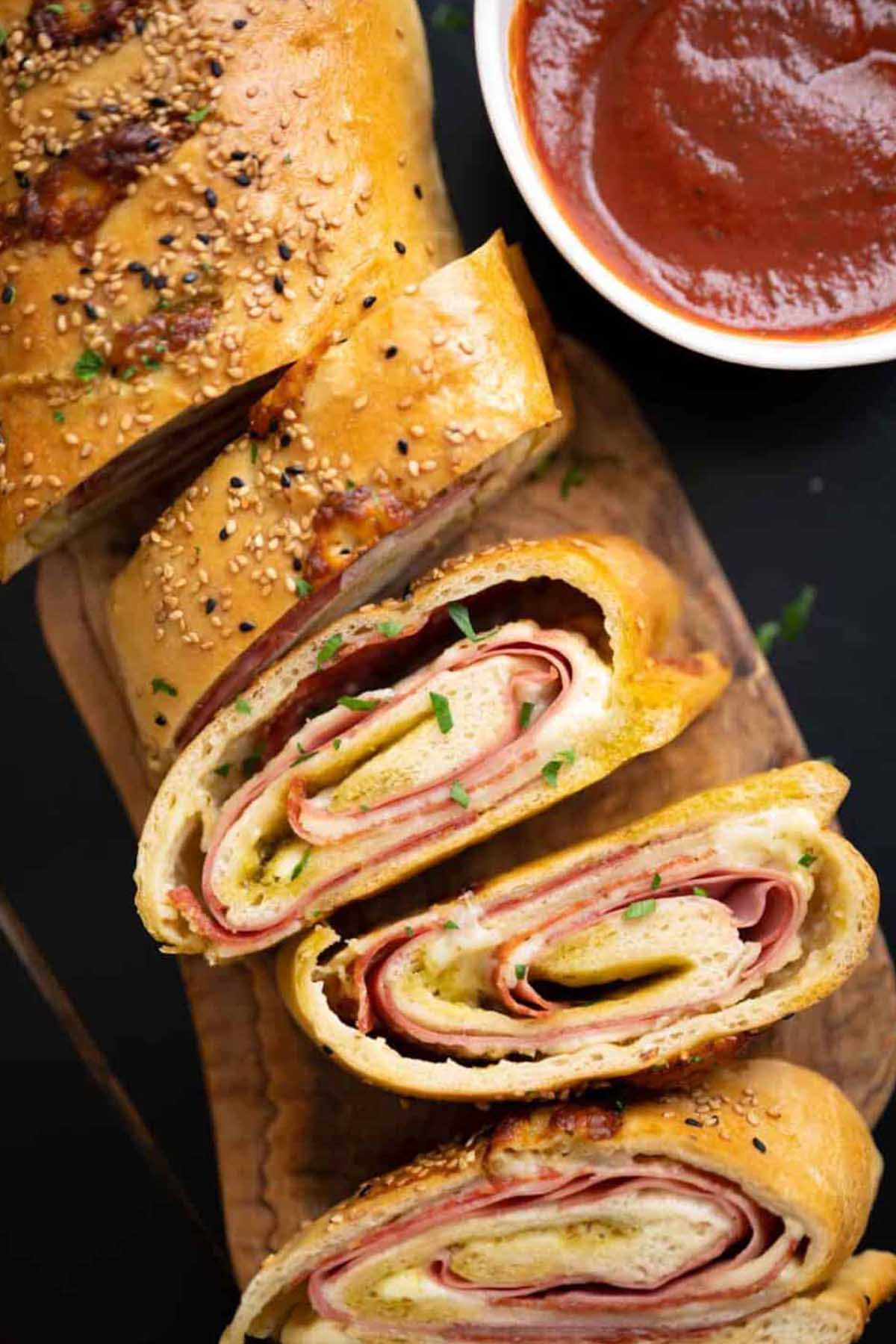 slices of Stromboli pizza with marinara dipping sauce.