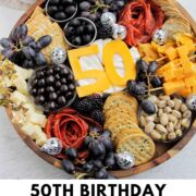 50th birthday charcuterie board with text overlay.