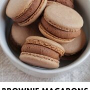 brownie flavored macarons in a bowl with text overlay.