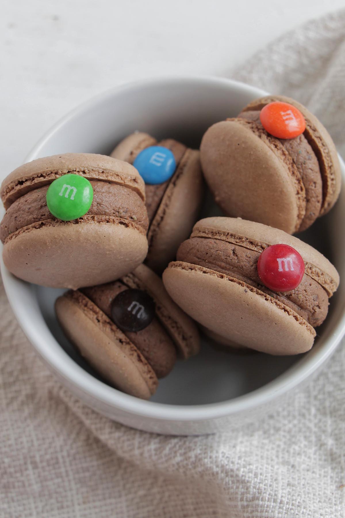 M&M macarons in a bowl.