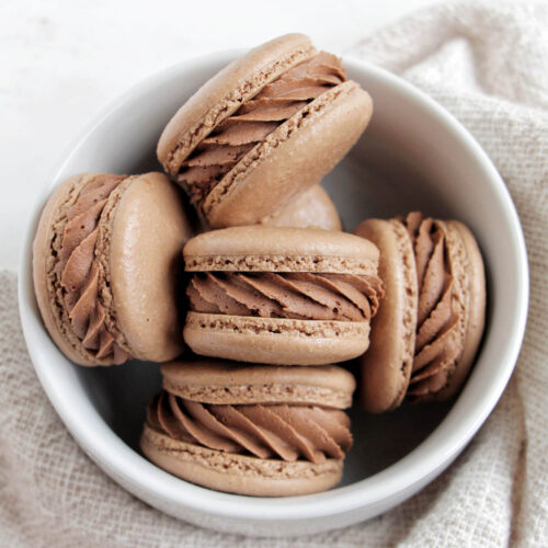 chocolate mint macarons in a bowl.