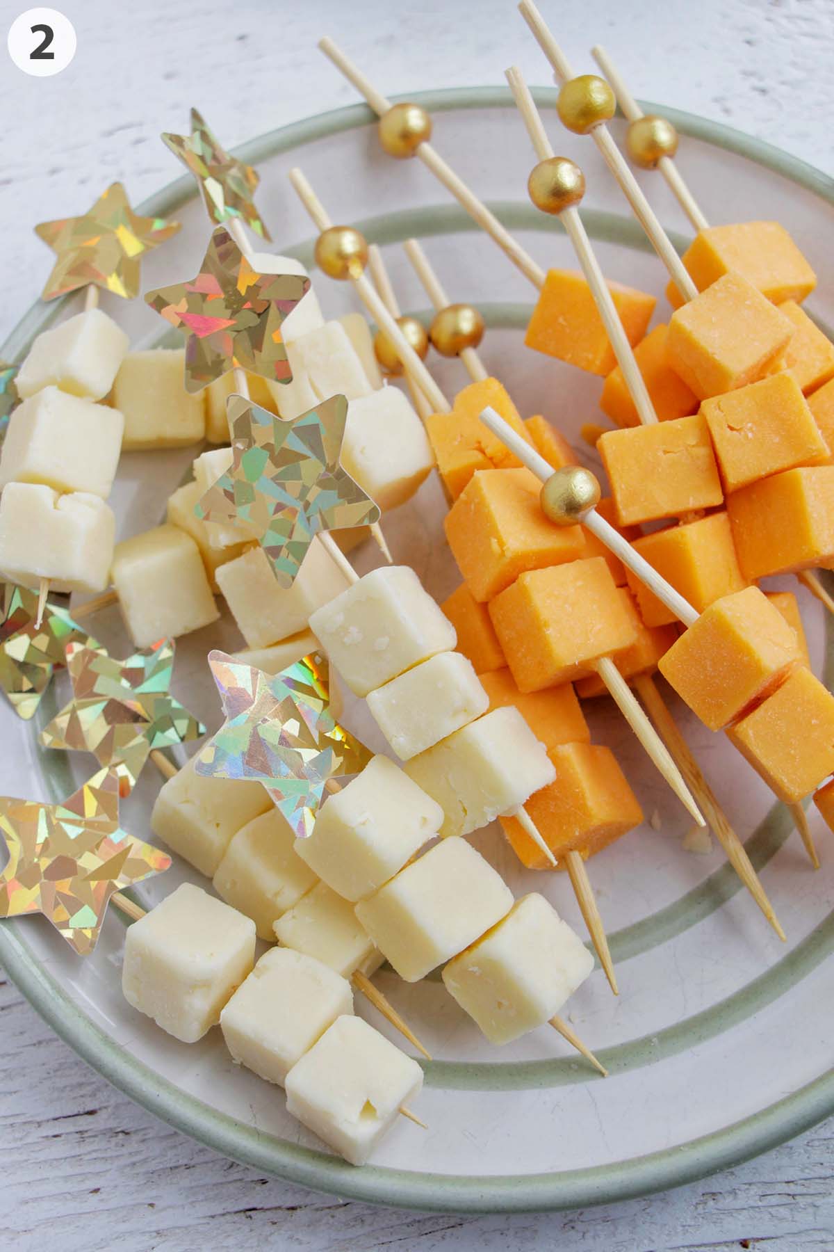 numbered photo showing cubed cheese on toothpicks.