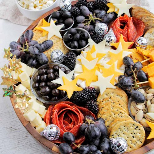 new years eve cheese board with star shaped cheese.