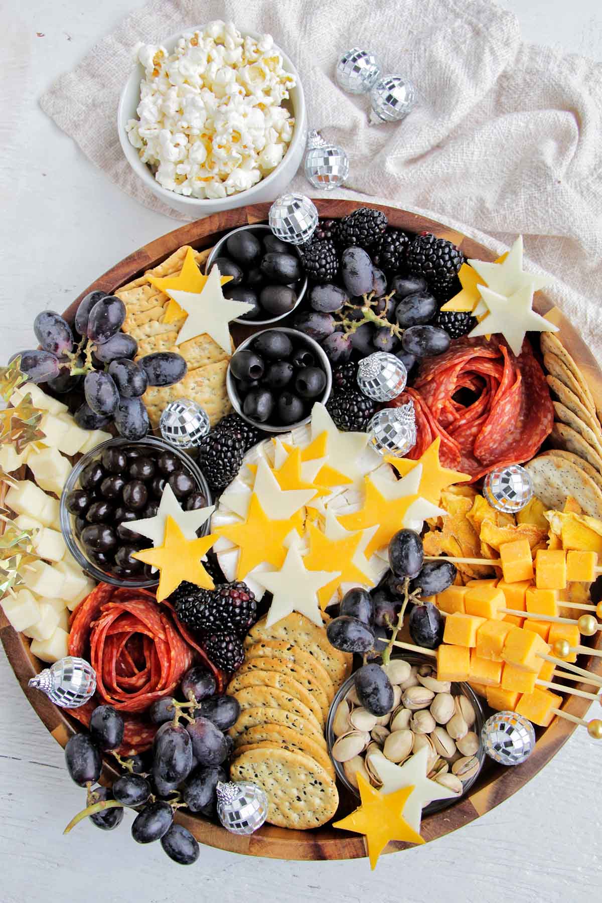 gold, white, and black new year's eve charcuterie board.
