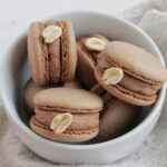 chocolate peanut butter macarons in a bowl.