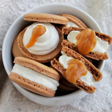 salted caramel filled macarons in a bowl.