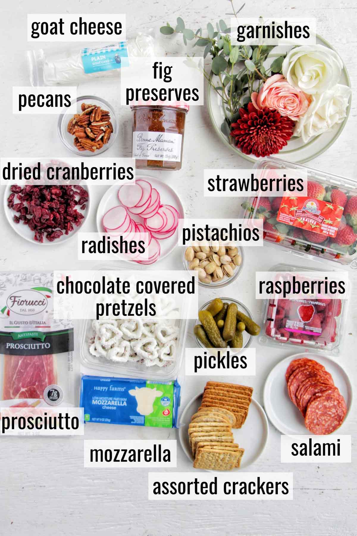 Valentine's Day charcuterie board ingredients with labels.